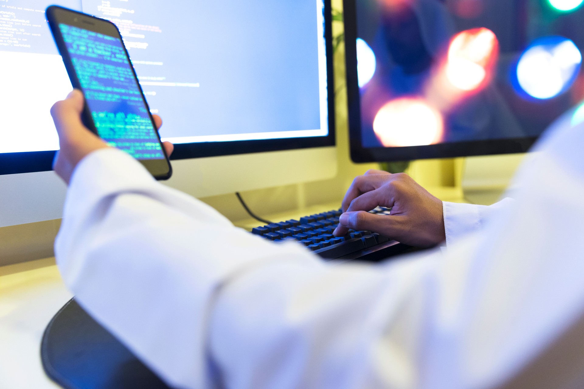 Aspiring young programmer working on freelance coding assignments from his home office.